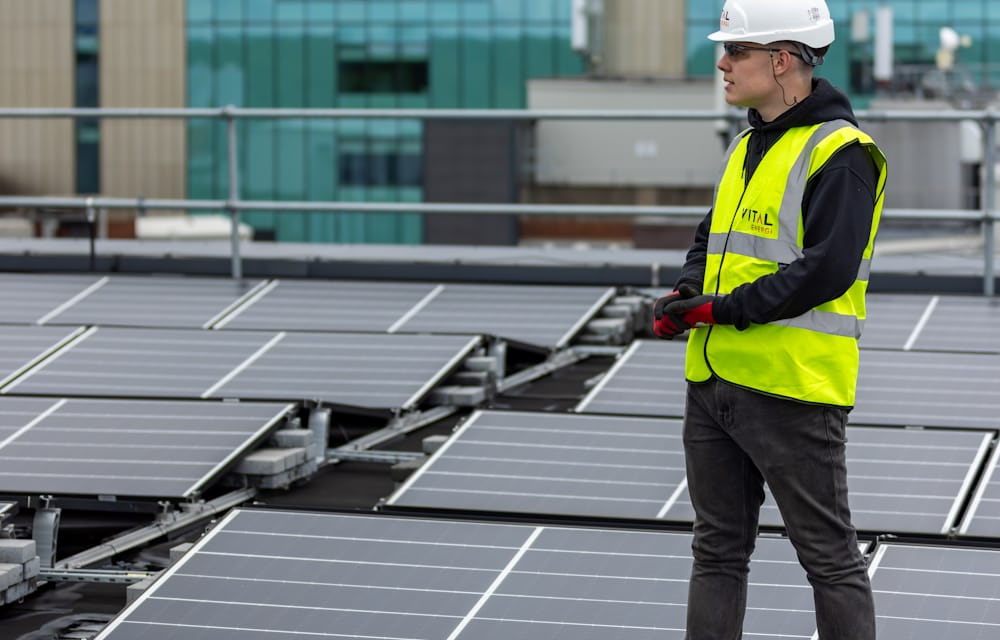 Najih engineer on a rooftop solar installation